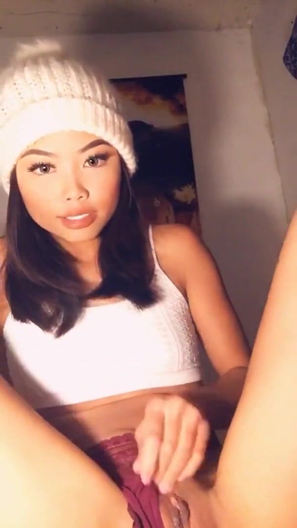 Asian teen in white beanie plays with her pussy